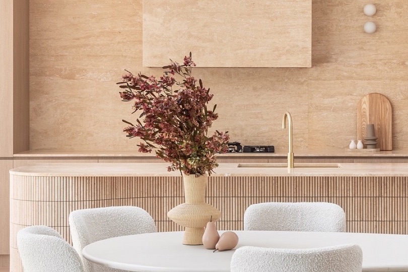 ENCANTO. ⠀⠀⠀⠀⠀⠀⠀⠀⠀ The kitchen at ENCANTO transcends luxury, becoming the heart of the home. With its fluted travertine countertops and bespoke stone finishes, it grounds the space, exuding a refined yet natural ambiance. Photographed by @abiinteriors DESIGN · DEVELOP · CONSTRUCT
