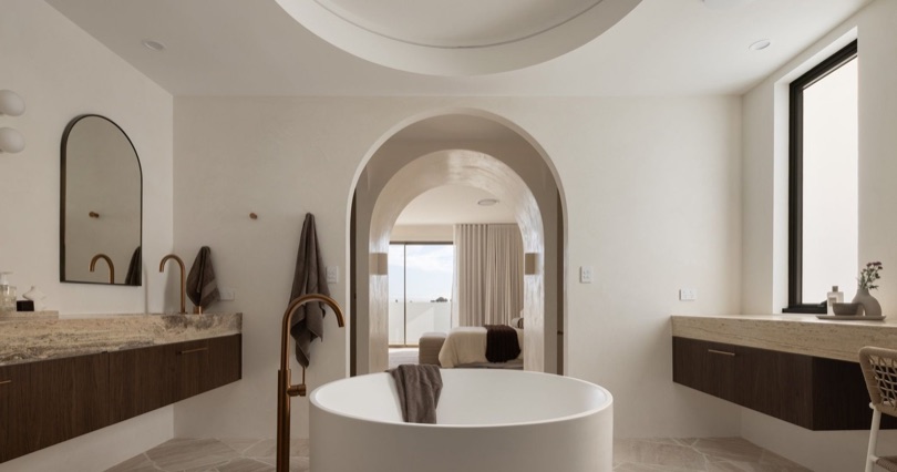 SOLACE The master ensuite at SOLACE is designed to feel less like a bathroom and more like a private retreat. Wrapped in natural travertine and softened by handcrafted Venetian plaster walls, every detail has been thoughtfully considered to create a timeless sense of luxury. A bespoke walnut vanity is complemented by…